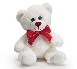 big white teddy bear with red bow